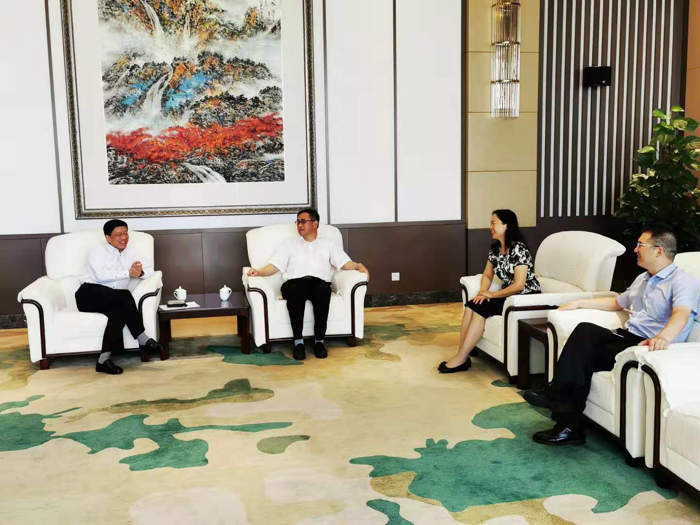 胡继灵副校长会见市政府办公厅巡视员熊新光、市高院副院长张斌一行